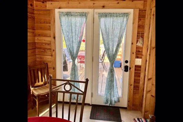 Red Roof Retreats - Red Roof Log Cabin, interior - double doors to patio - Lake of Egypt - Goreville, IL
